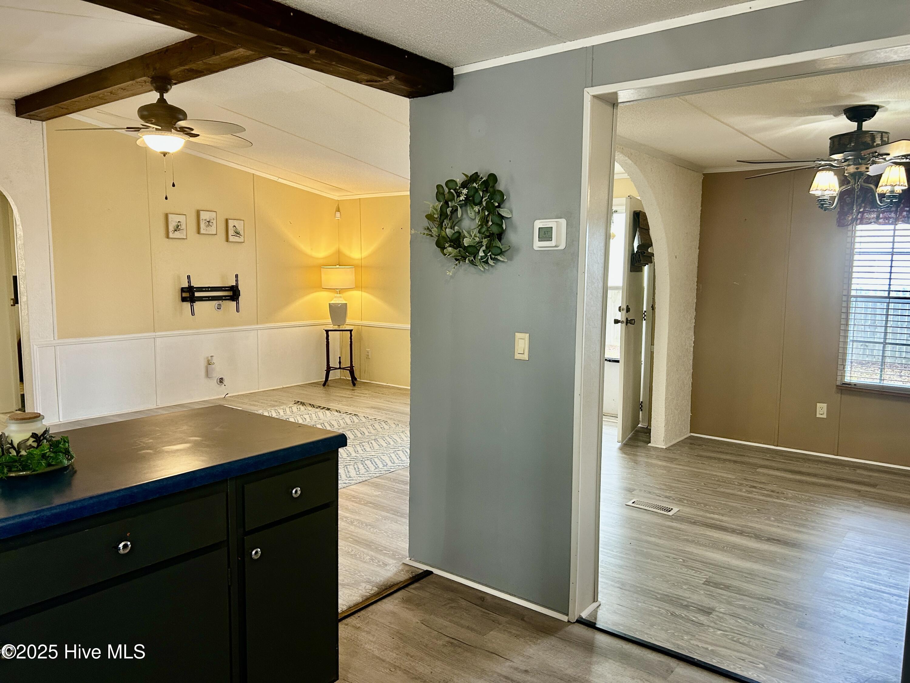 101 Dudley Farm Road Scotland Neck, NC 27874 - Photo 11 of 45 kitchen view looking into dining room (right) and living room (ahead)