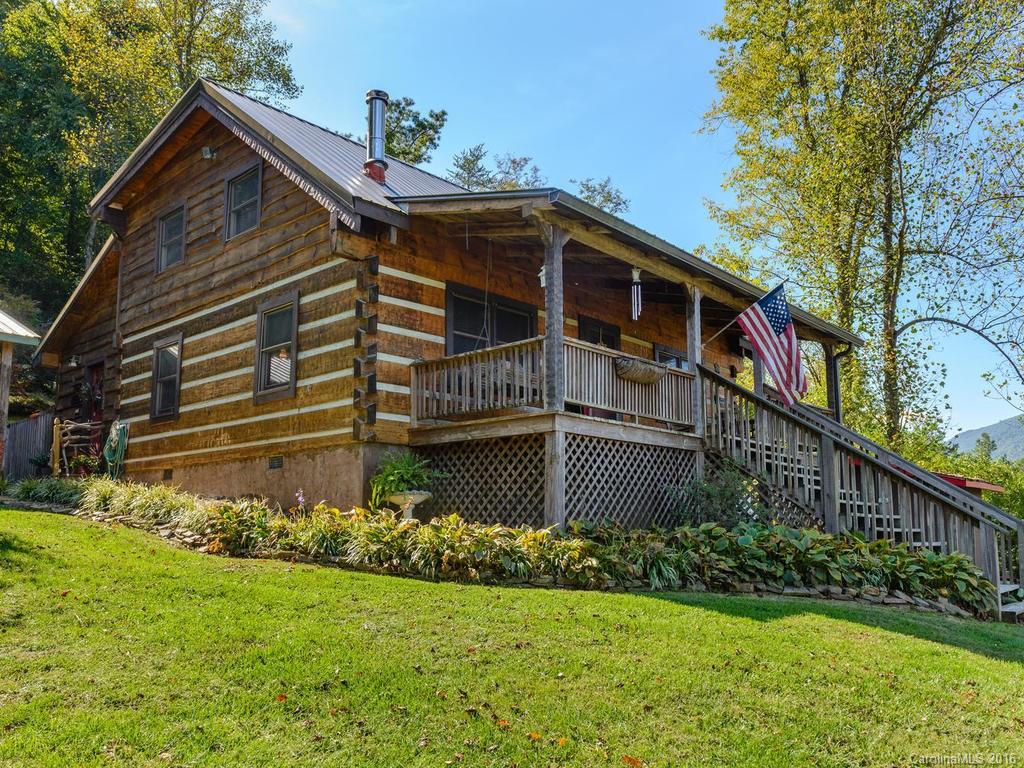 27 High Ridge Road Leicester, NC 28748 - Photo 1 of 24 a front view of a house with a yard