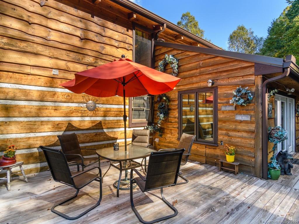 27 High Ridge Road Leicester, NC 28748 - Photo 22 of 24 a patio with a patio table and chairs