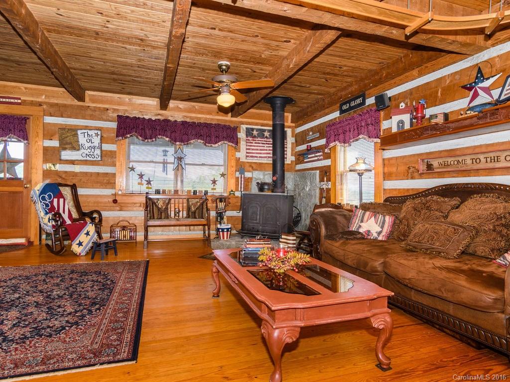 27 High Ridge Road Leicester, NC 28748 - Photo 6 of 24 a living room with lots of furniture and a rug