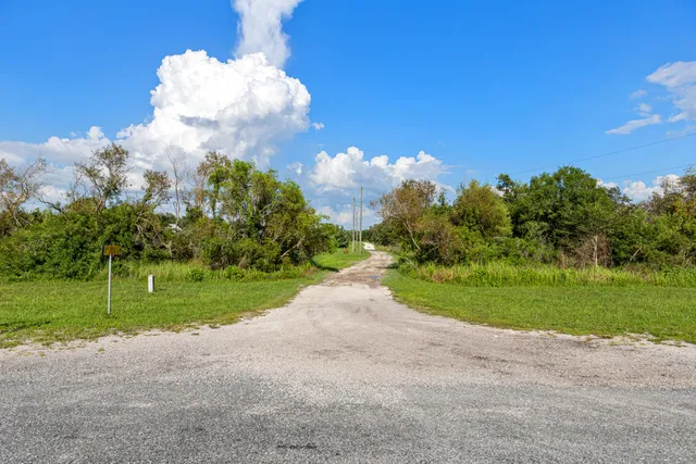 a view of a golf course with a house