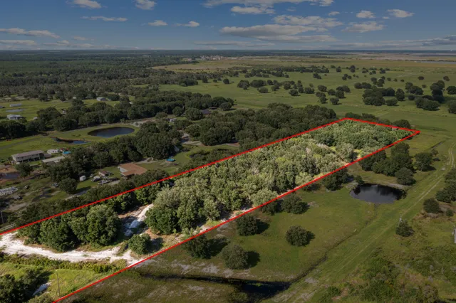 a view of a yard with a wooden deck