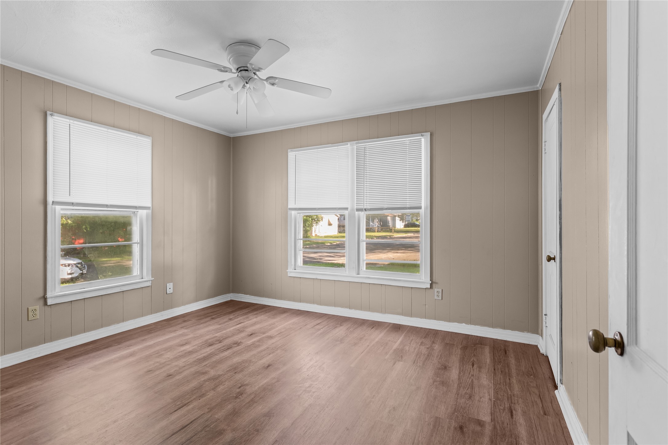 801 Evetts Road Killeen, TX 76541 - Photo 8 of 16 A well-lit interior space with rich plank flooring and a classic ceiling fan.