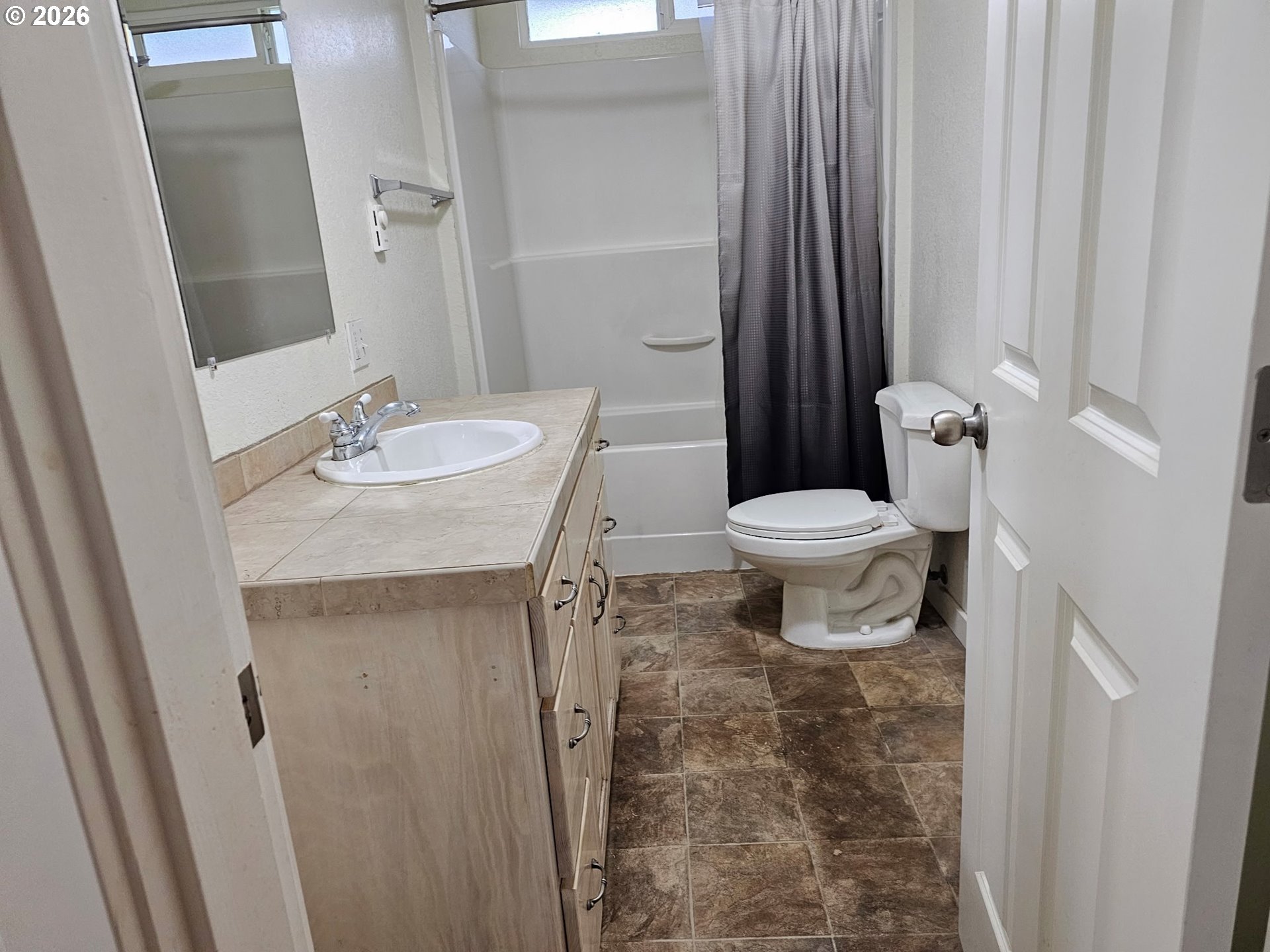 33802 Market Road Creswell, OR 97426 - Photo 11 of 30 a white toilet sitting next to a bathroom sink