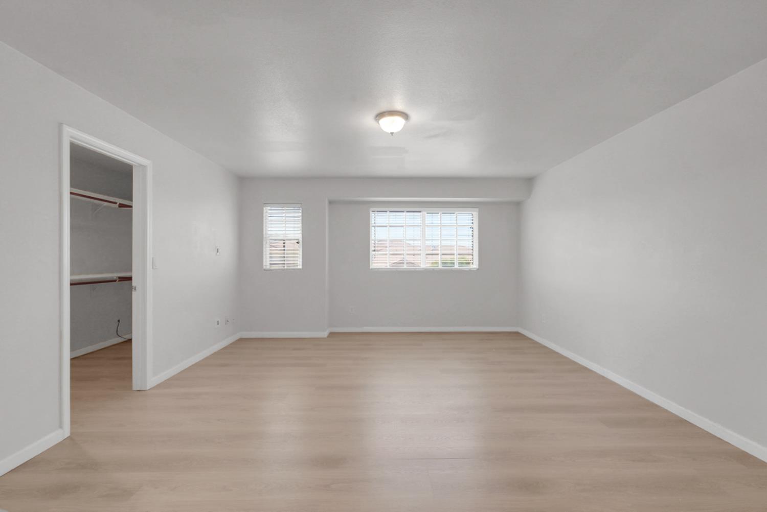 1412 Red Ribbons Lane Manteca, CA 95337 - Photo 23 of 32 an empty room with windows