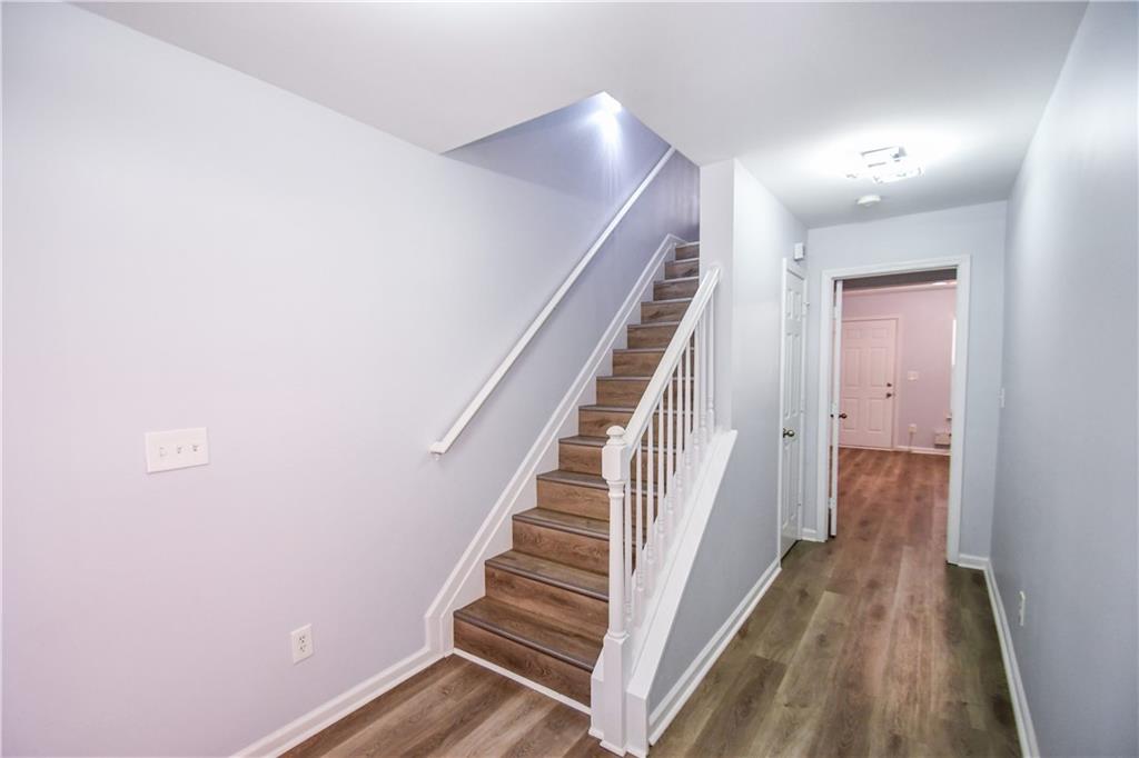 2201 Landing Walk Drive Duluth, GA 30097 - Photo 15 of 80 a view of a hallway with staircase