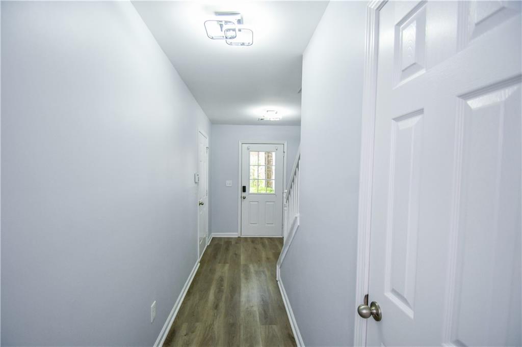 2201 Landing Walk Drive Duluth, GA 30097 - Photo 19 of 80 a view of a hallway with wooden floor