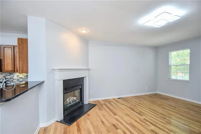 a kitchen with granite countertop stainless steel appliances and wooden cabinets