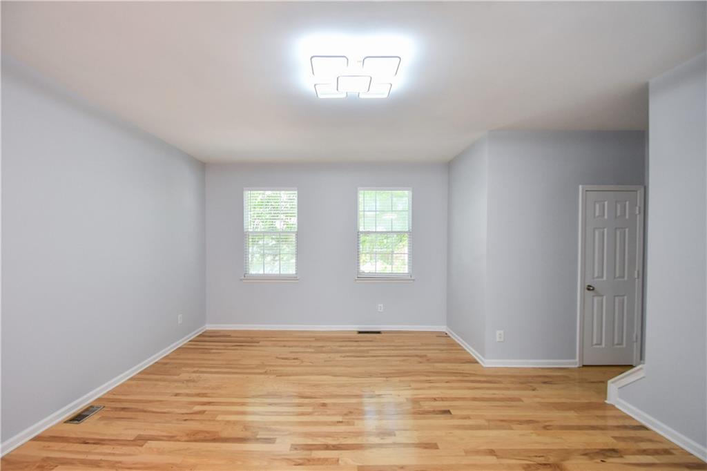 2201 Landing Walk Drive Duluth, GA 30097 - Photo 26 of 80 a view of empty room with wooden floor and fan