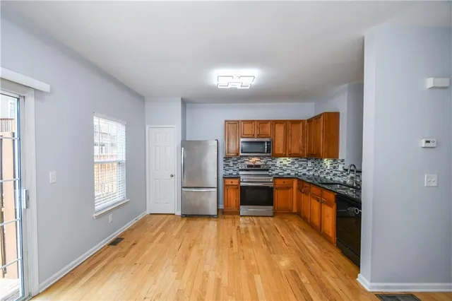 a bathroom with a sink a shower and a mirror