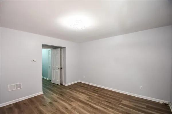 a bathroom with a sink a toilet and shower curtain