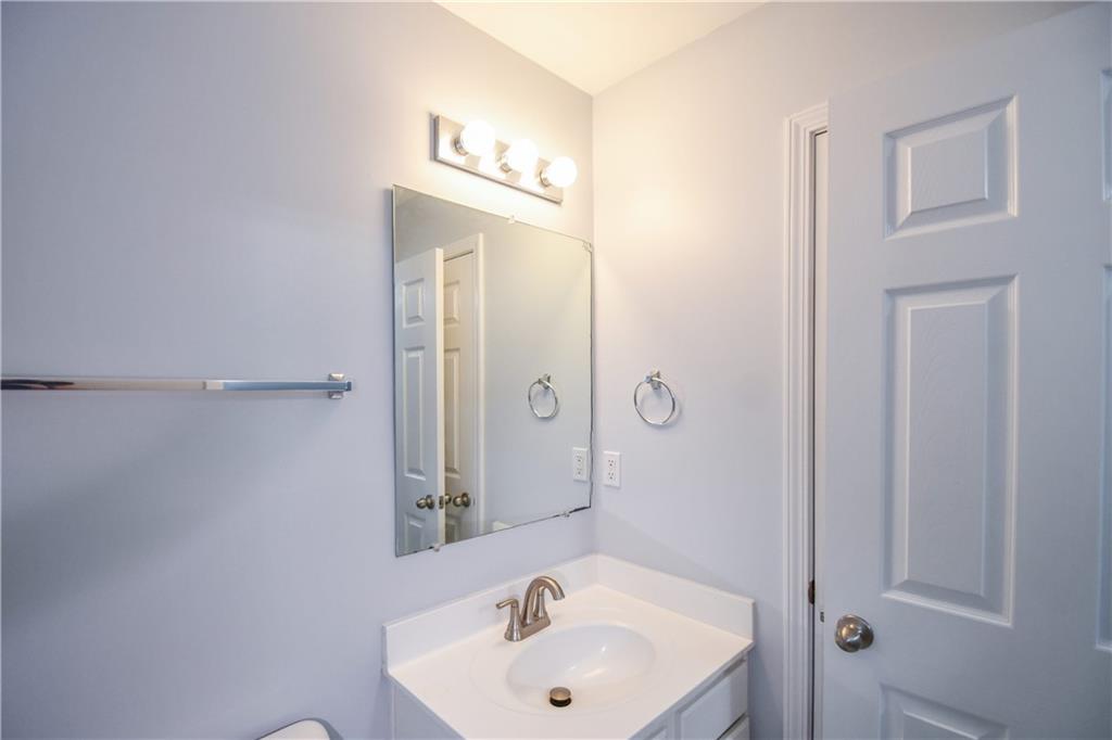 2201 Landing Walk Drive Duluth, GA 30097 - Photo 50 of 80 a bathroom with a sink a shower and a mirror