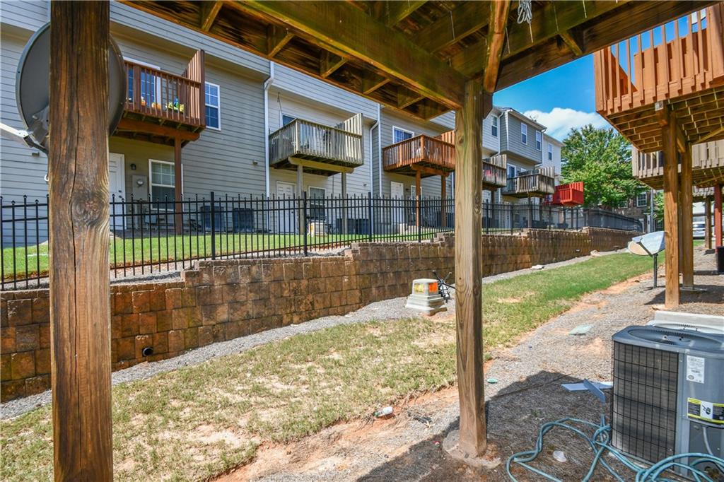 2201 Landing Walk Drive Duluth, GA 30097 - Photo 52 of 80 a view of a patio with a table and chairs