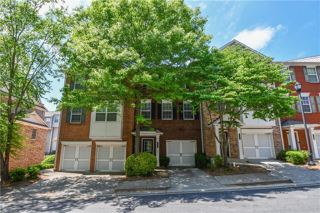 2201 Landing Walk Drive Duluth, GA 30097 - Photo 6 of 80 a front view of a house with garden