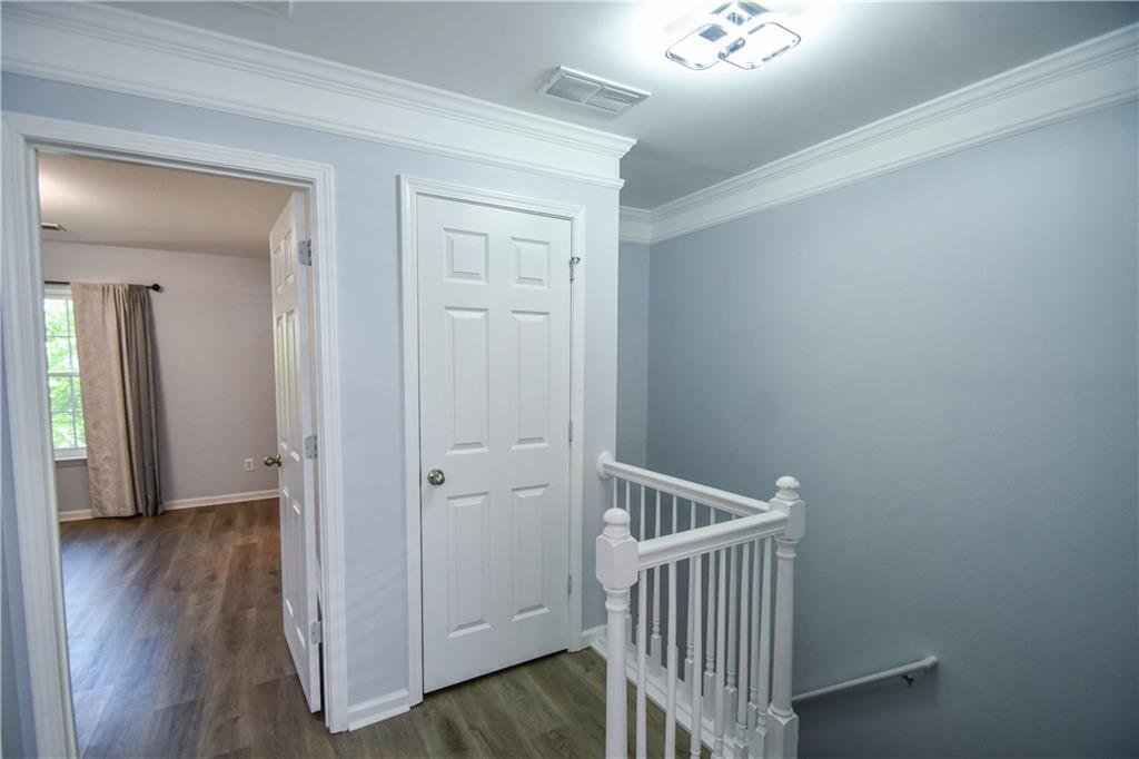 2201 Landing Walk Drive Duluth, GA 30097 - Photo 68 of 80 a view of a hallway with wooden floor
