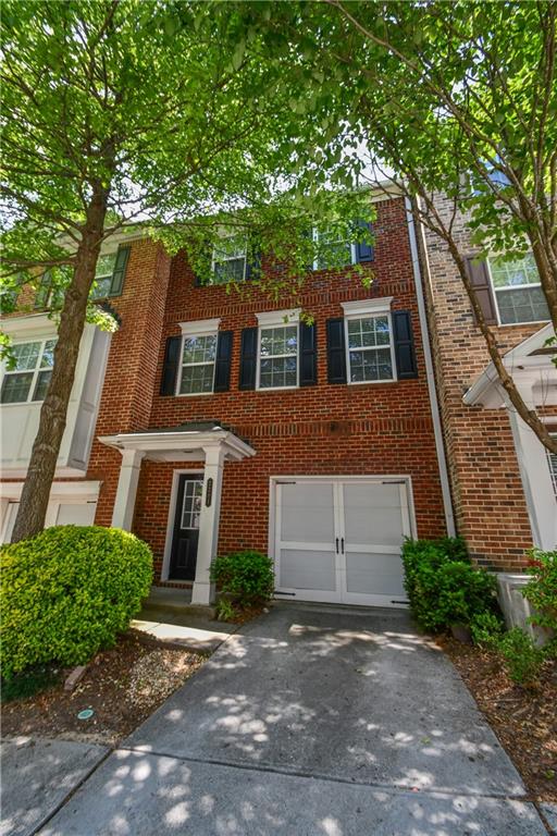 2201 Landing Walk Drive Duluth, GA 30097 - Photo 9 of 80 a front view of a house with a garden
