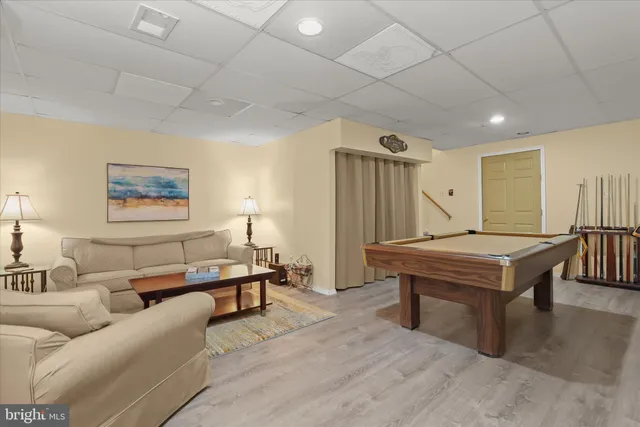 a living room with furniture and a table