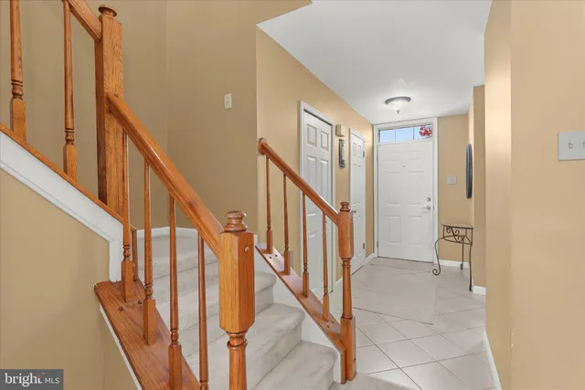 a kitchen with stainless steel appliances granite countertop a refrigerator stove top oven and sink