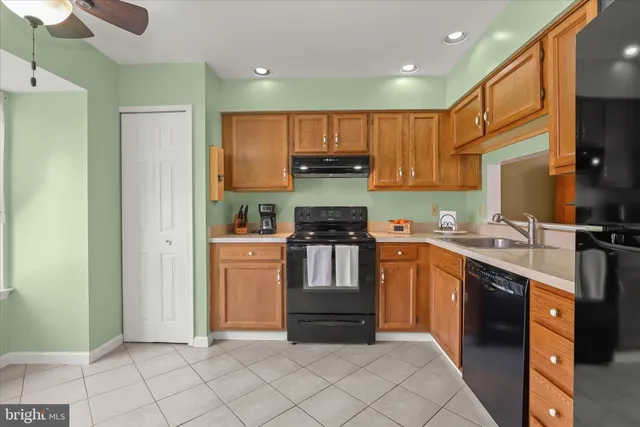 a view of an entryway with a chandelier fan