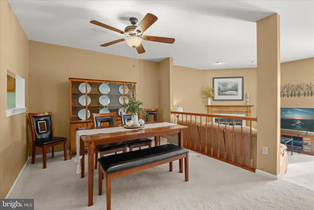 a view of a livingroom with furniture and a workspace