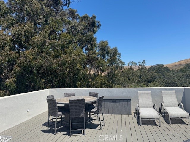 61 Birch Avenue Cayucos, CA 93430 - Photo 3 of 21 a view of a patio with a table and chairs