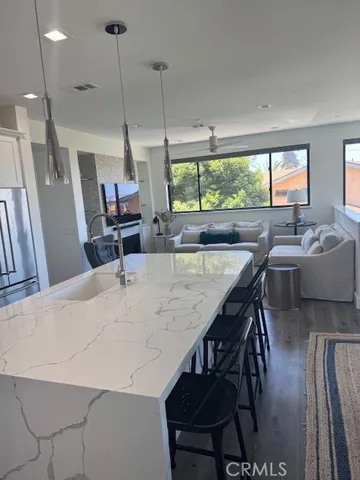a dining room with furniture window and wooden floor