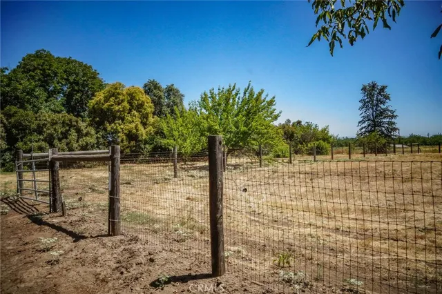 a view of pool with outdoor seating and yard in back