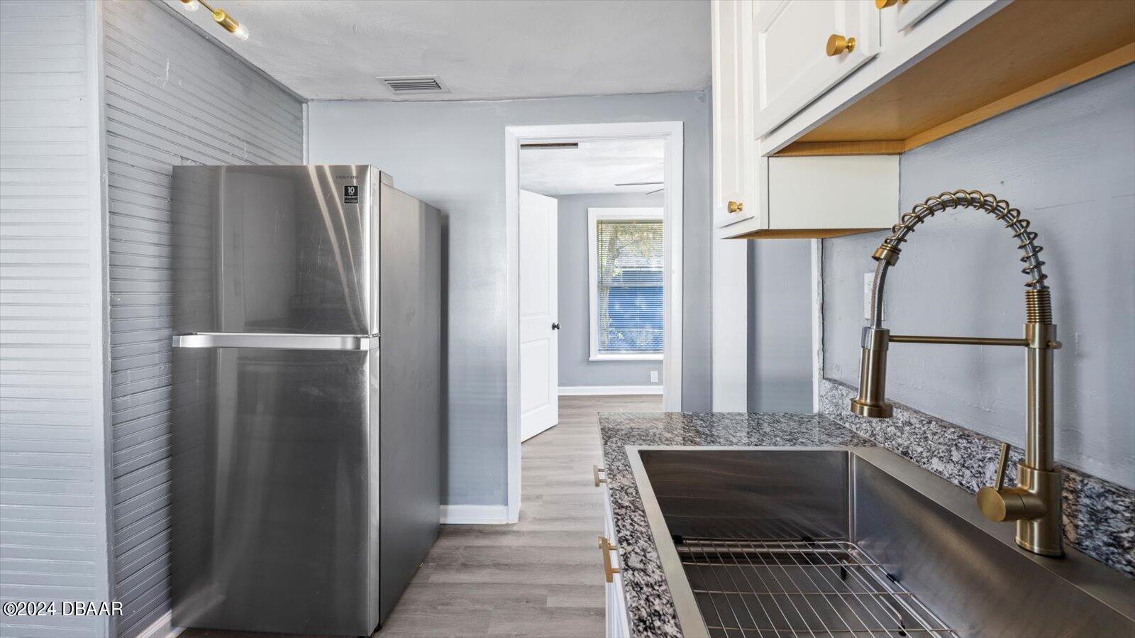 269 Selden Avenue Ormond Beach, FL 32174 - Photo 15 of 41 a bathroom with a double vanity sink and a mirror