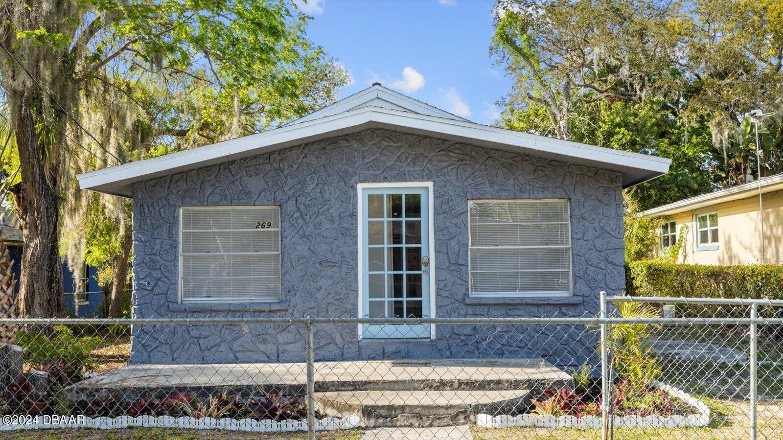 269 Selden Avenue Ormond Beach, FL 32174 - Photo 2 of 41 a front view of a house with garden