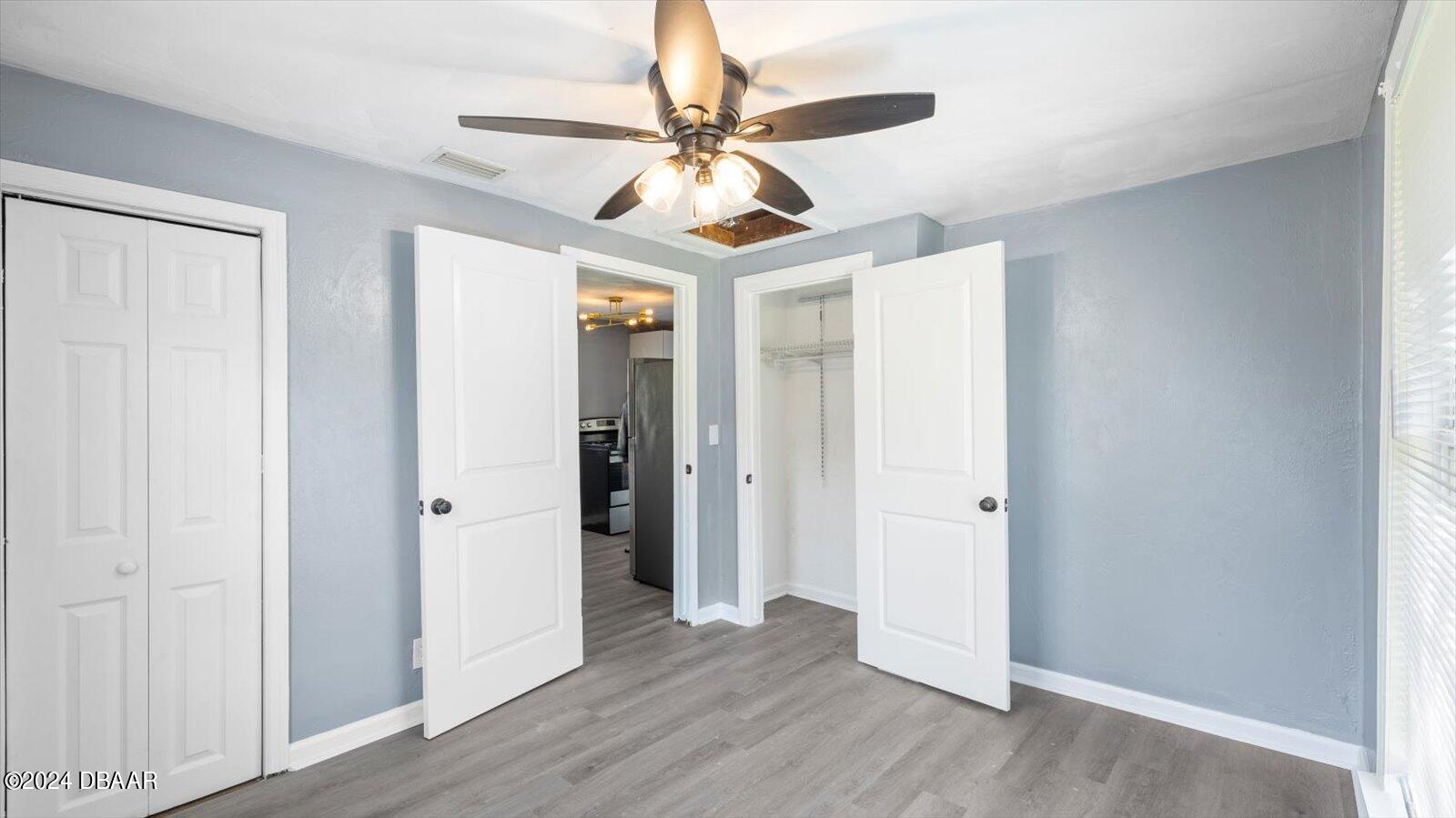 269 Selden Avenue Ormond Beach, FL 32174 - Photo 26 of 41 a view of a livingroom with a ceiling fan and wooden floor