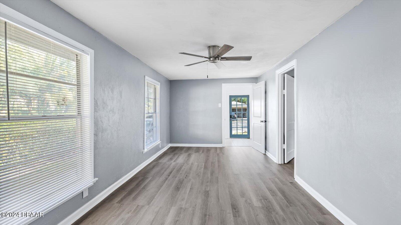 269 Selden Avenue Ormond Beach, FL 32174 - Photo 28 of 41 a view of a livingroom with wooden floor and a ceiling fan