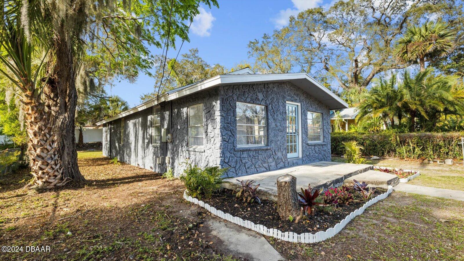 269 Selden Avenue Ormond Beach, FL 32174 - Photo 31 of 41 a view of a house with a yard
