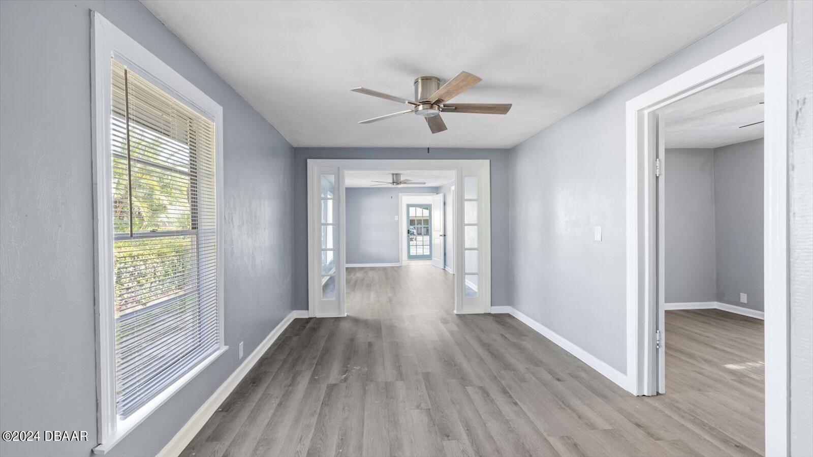 269 Selden Avenue Ormond Beach, FL 32174 - Photo 8 of 41 a view of hallway with wooden floor and fan