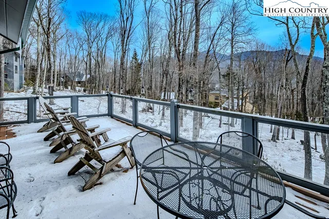 a view of a chairs and table in the balcony