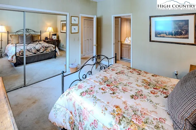 a bedroom with a bed and walk in closet