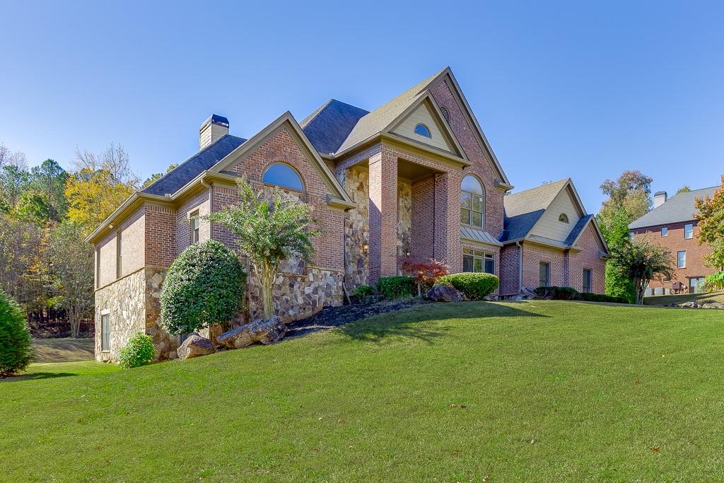 940 Chateau Forest Road Hoschton, GA 30548 - Photo 75 of 87 a front view of house with yard and green space