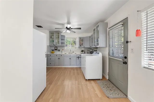 a kitchen with a refrigerator a sink and dishwasher