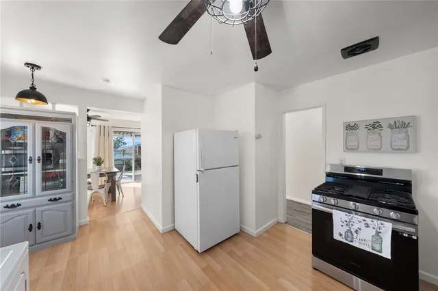 a kitchen with stainless steel appliances granite countertop a stove and a refrigerator
