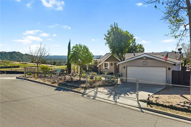 a view of a chair and tables in the balcony