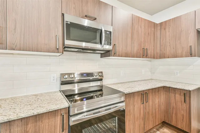 a kitchen with a stove and a microwave
