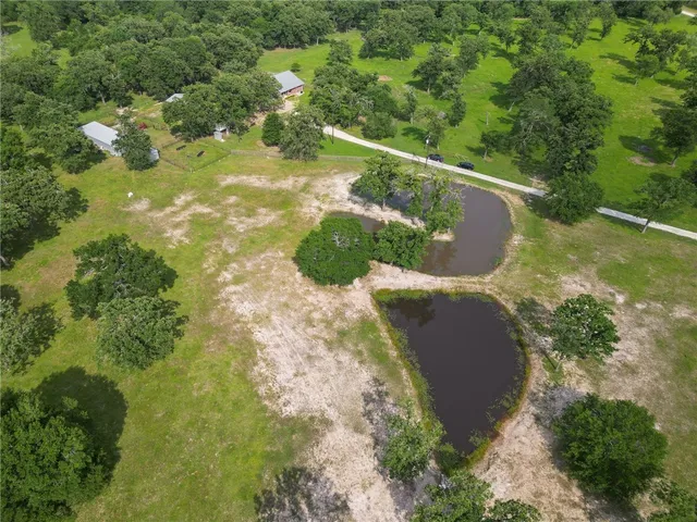 a view of a lake with a yard