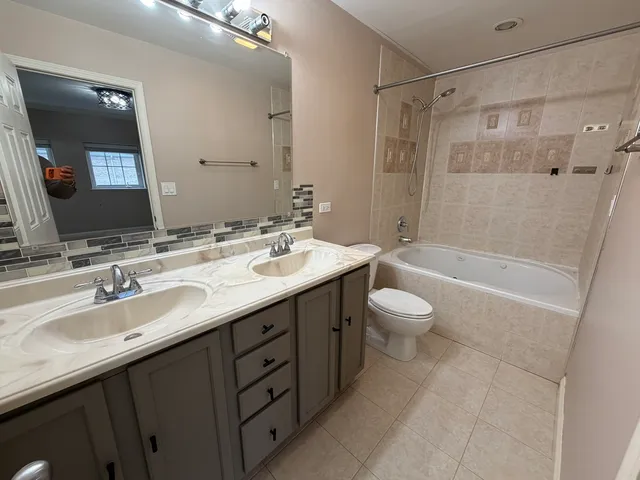 a view of a hallway with washer and dryer