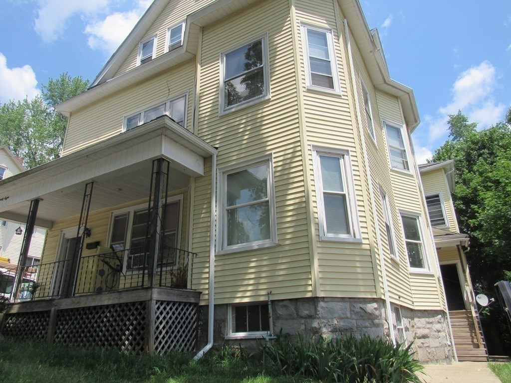 98 Brookline Street, Unit 1 Worcester, MA 01603 - Photo 3 of 18 a view of a house with a yard