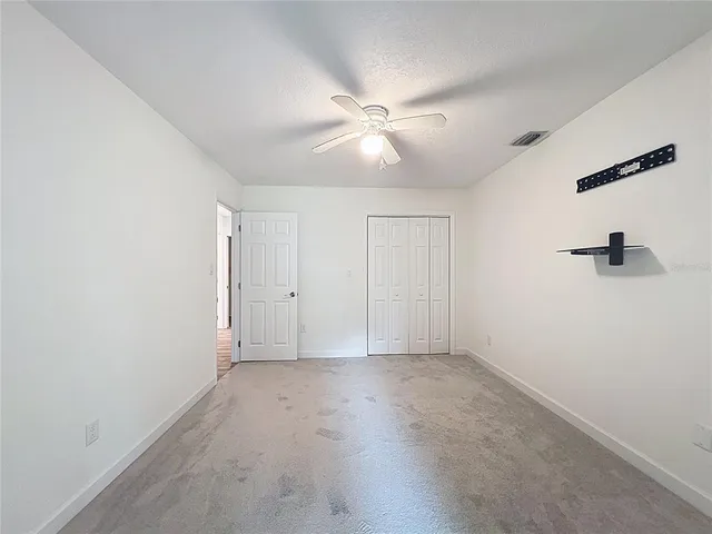a view of kitchen with cabinets