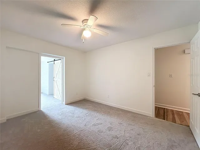 a view of a house with backyard porch and sitting area