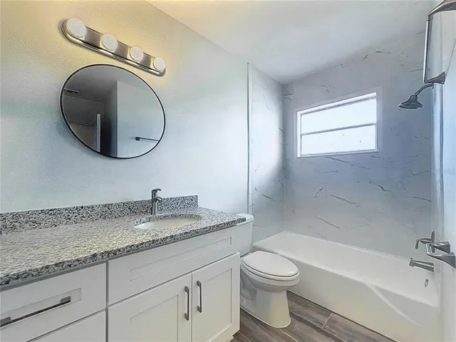 a view of a swimming pool with a yard