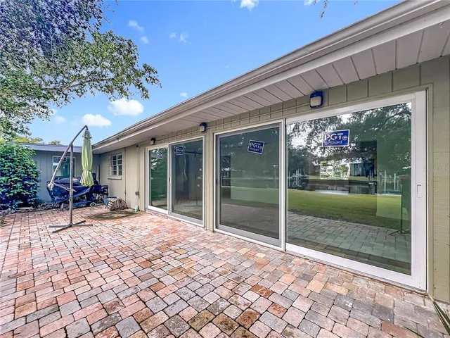 an aerial view of a residential apartment building with a yard