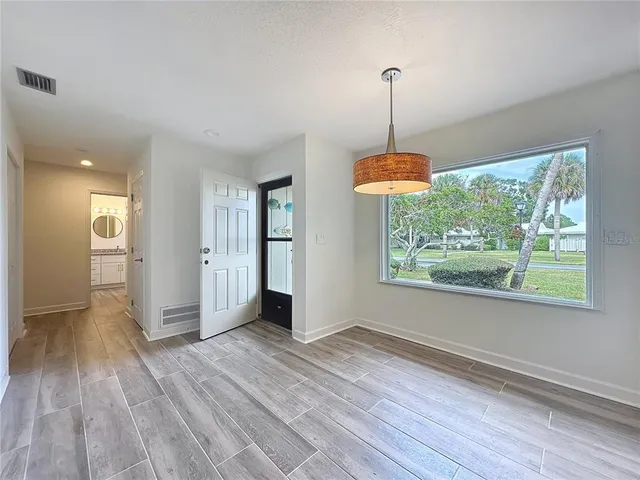 a kitchen with a sink cabinets and window