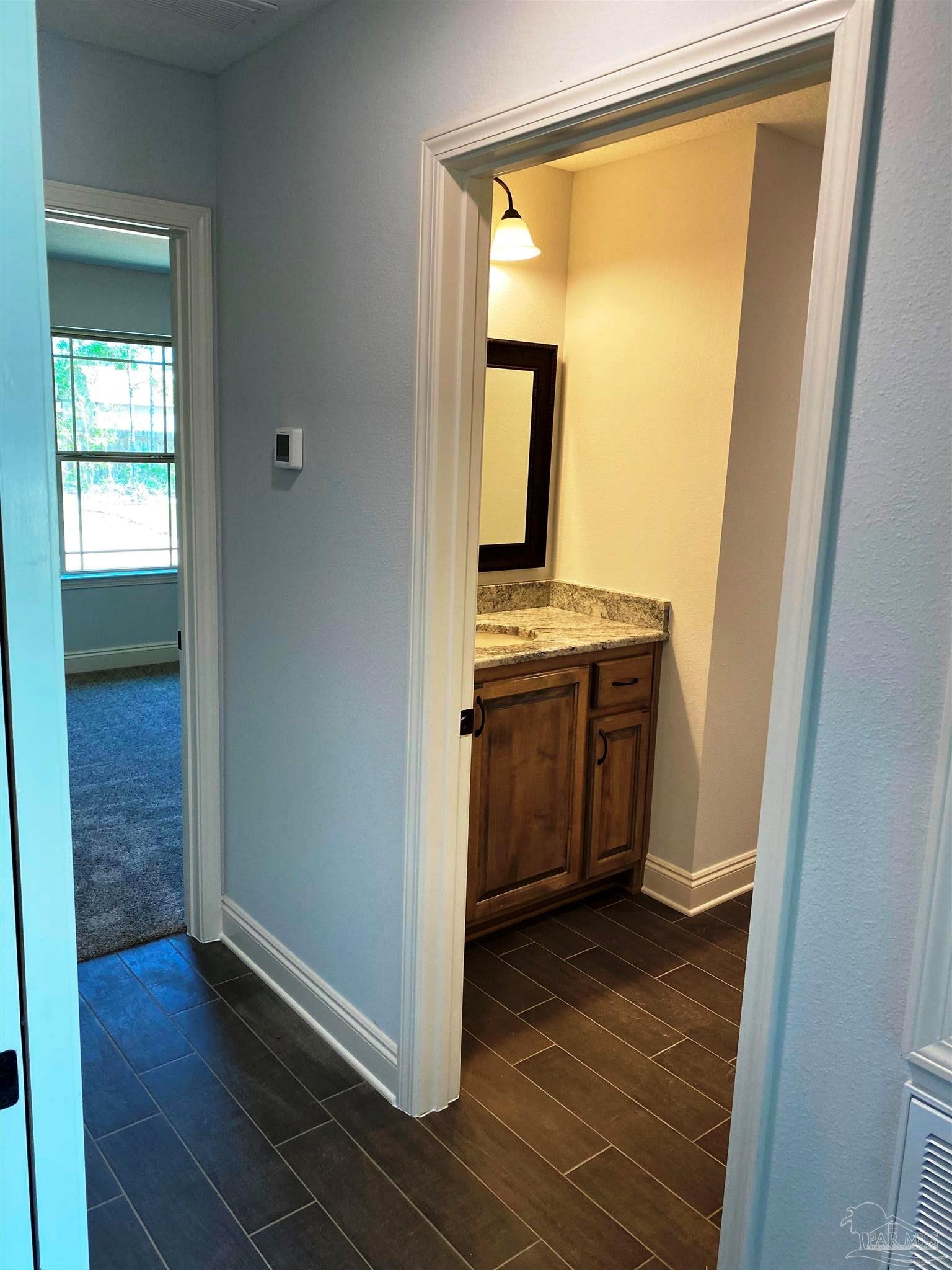 5424 South A Jones Road Milton, FL 32583 - Photo 3 of 27 Guest hall leads to 2 bedrooms & 1 bath.