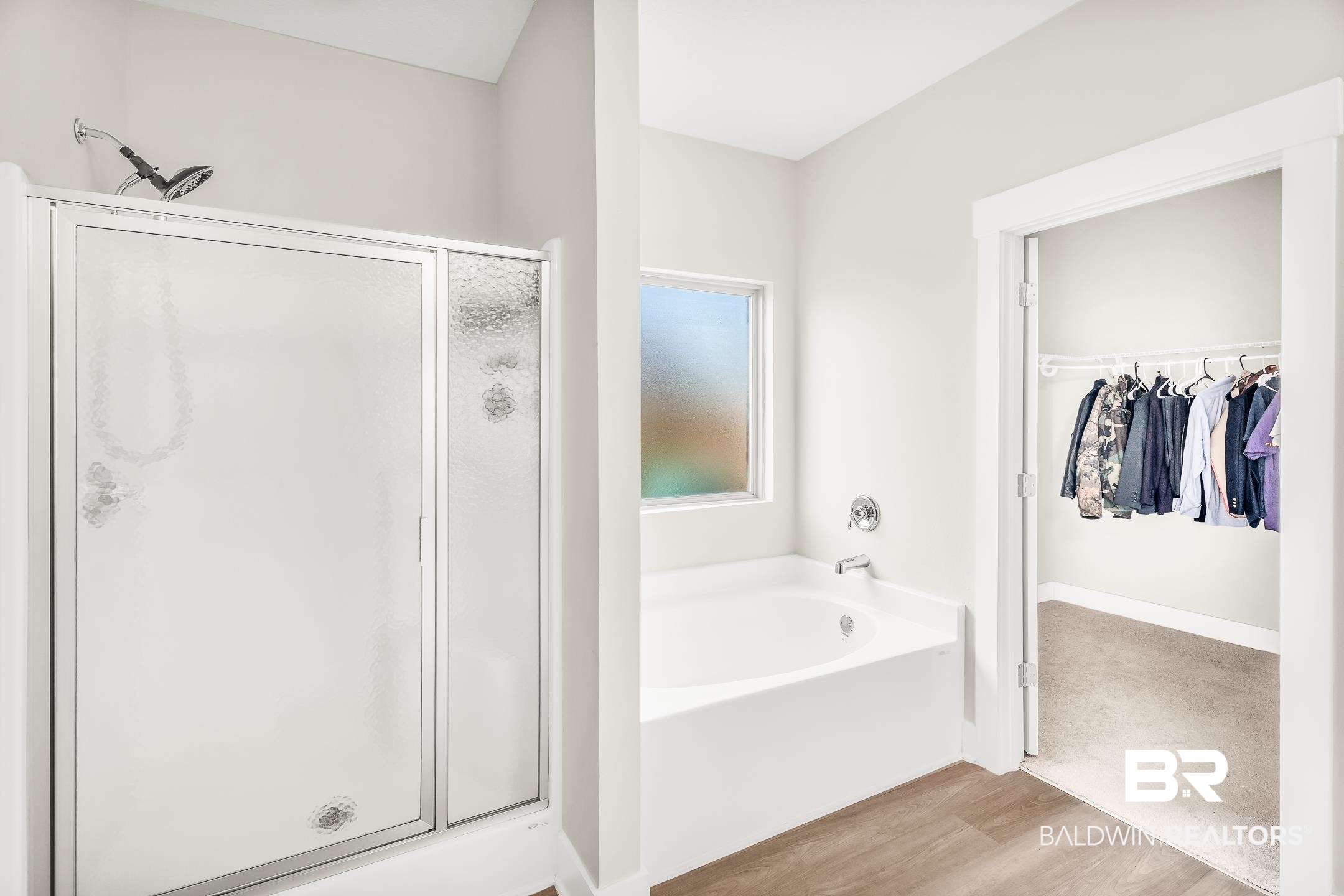 1720 Partridge Street Foley, AL 36535 - Photo 19 of 32 Bathroom featuring plus walk in shower and hardwood / wood-style floors
